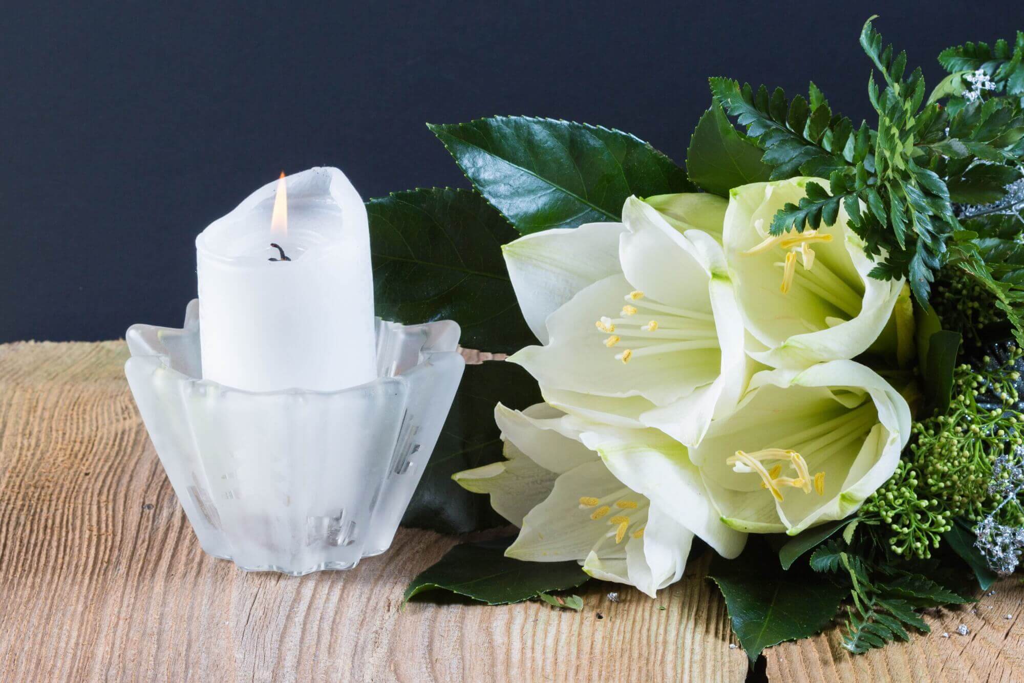 funeral flowers and candle